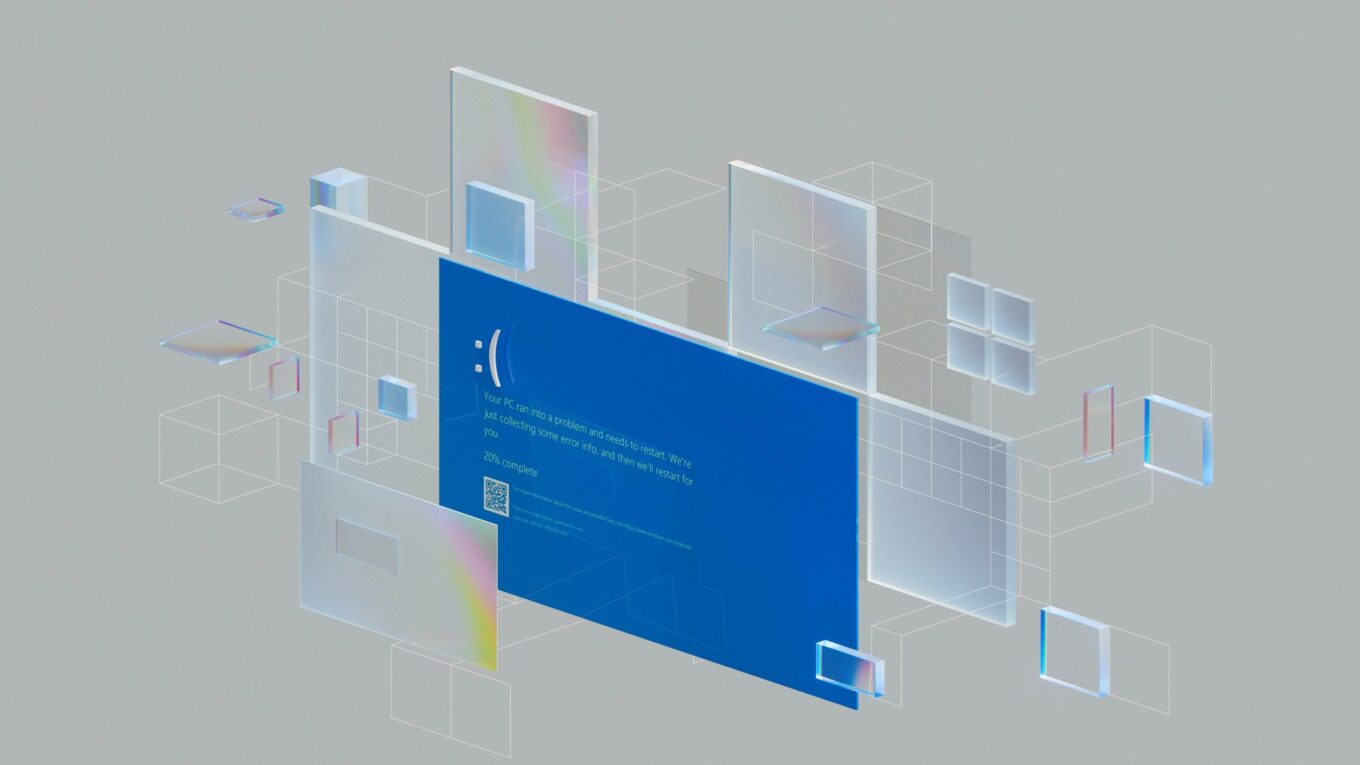 A stylized digital representation of a computer crash screen with a blue error message, surrounded by transparent, holographic-like floating squares and rectangles, illustrating the CrowdStrike incident.